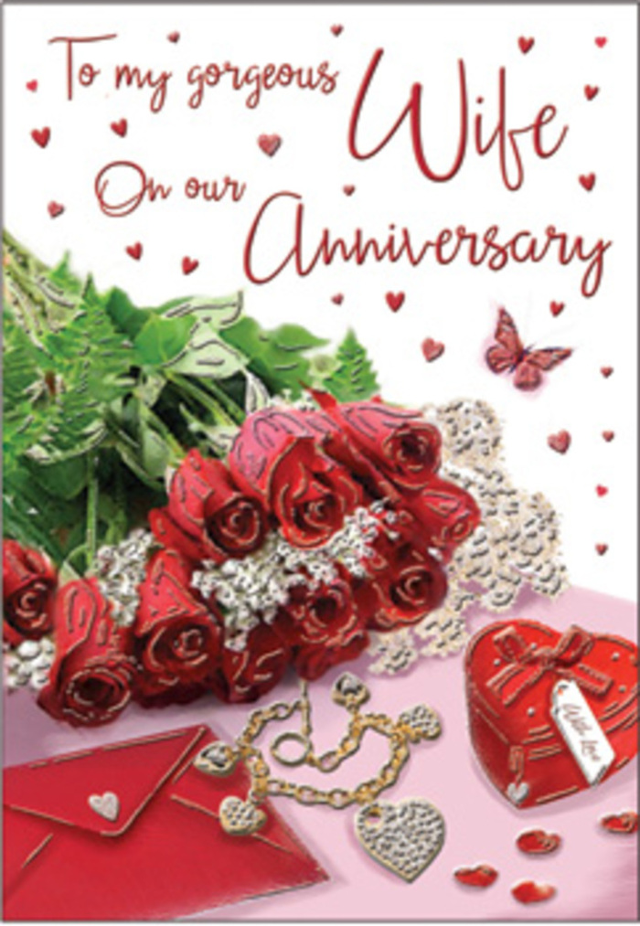 In this romantic anniversary card, the scene is composed with the same care an Epsom florist might use when preparing a bespoke bouquet for a long-married couple. A classic arrangement of red roses forms the focal point, each bloom generously open, revealing layer upon layer of velvety petals in rich, jewel-toned crimson. The flowers are gathered in an elegant, slightly cascading cluster, wrapped in soft folds that suggest fine paper or delicate fabric, and interwoven with lush greenery that spills gently outward. Around this central bouquet, thoughtful details hint at years of treasured moments: a jewellery set, perhaps a necklace and matching earrings, lies beside a vivid red box whose smooth, satin-like finish reflects the warm light, recalling surprise gifts offered across a candlelit table. Small heart motifs, some printed, some like tiny charms, appear to dance across the card's surface, echoing anniversary celebrations held in cosy homes off Church Street or near Epsom Common. A lace-like pattern and subtle textures of velvet, gold, and silk weave through the design, adding layers of visual softness and luxury without overwhelming the simple sincerity of the roses. The scripted message curves gracefully through the composition, lettering that feels handwritten and heartfelt rather than formal or distant. Throughout, the lighting remains gentle and romantic, casting delicate highlights on the petals and a tender glow on the jewellery. The overall effect is that of a warm embrace captured on paper: timeless, deeply affectionate, and perfectly suited to honouring an enduring love story nurtured year after year in Epsom.